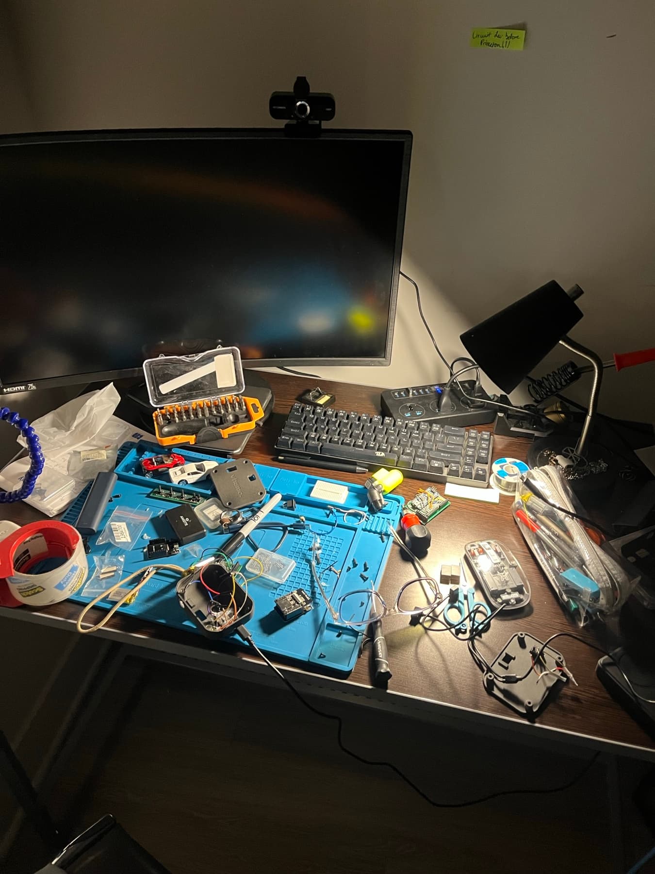 A college dorm desk covered in unfinished VHSMO prototypes